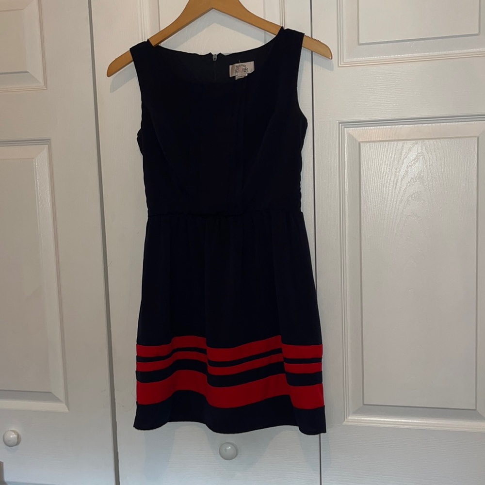Beautiful mini dark blue dress with red stripes at the bottom. Only used twice!